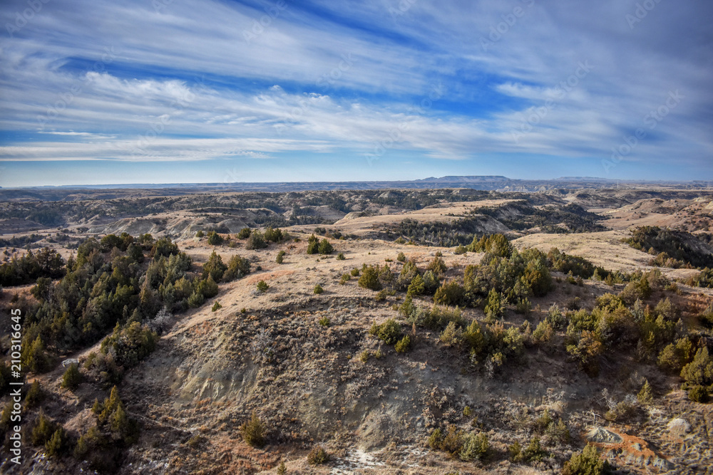 A hiking path way leading across the grassland canyons showing nothing but the most scenic views known to man.