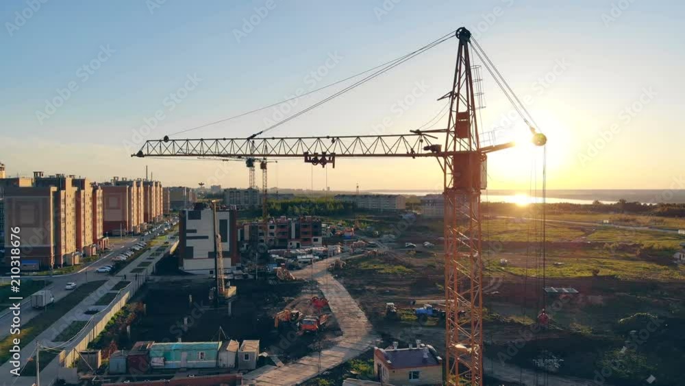 Big crane on a sunset background. Aerial. Big crane on a sunset background. Aerial.