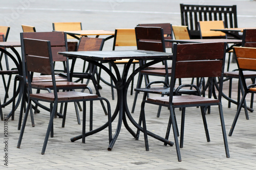 Empty coffee terrace with tables and chairs