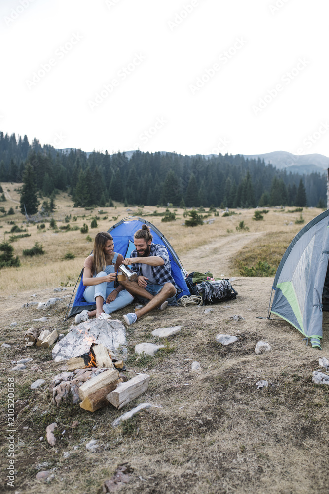 Fototapeta premium Couple Camping in Mountain