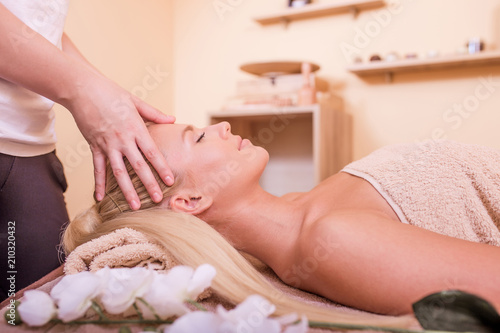 Woman having head massage © Jovica Varga