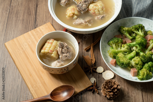 Bone soup with wood grain background