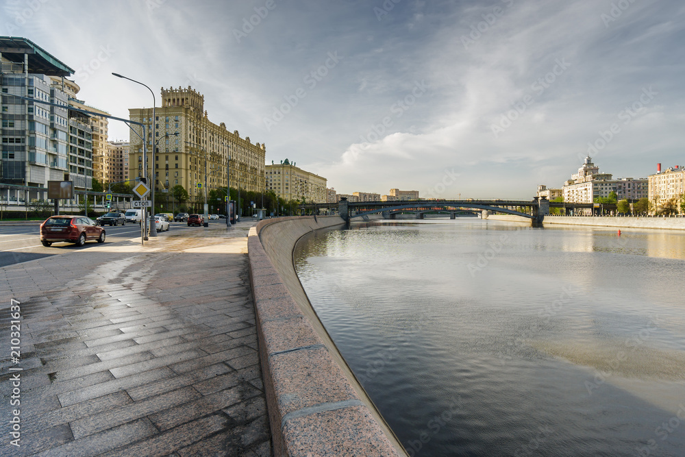 Sunny morning view of Smolenskaya embankment and Moskva river, Moscow, Russia.