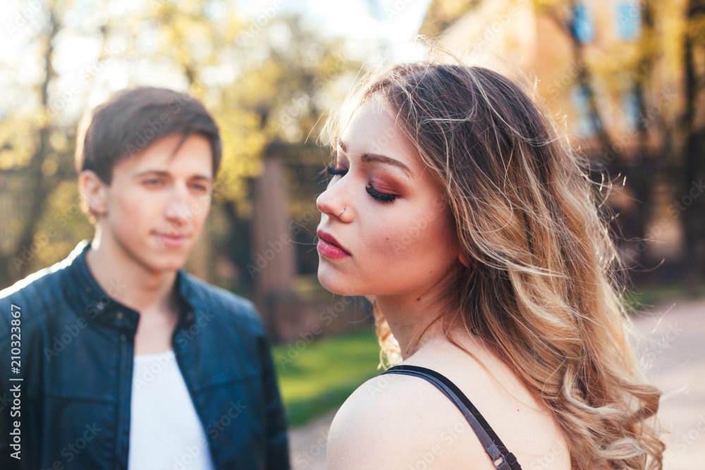Young beautiful couple in love hugging and kissing on the street city Young beautiful couple in love hugging and kissing on the street city