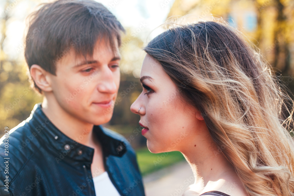 Young beautiful couple in love hugging and kissing on the street city Young beautiful couple in love hugging and kissing on the street city