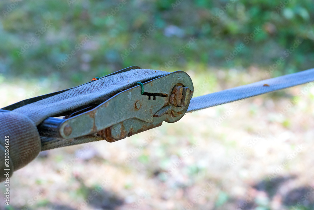 Foto de Old ratchet straps for cargo control.Mechanism of tension of
