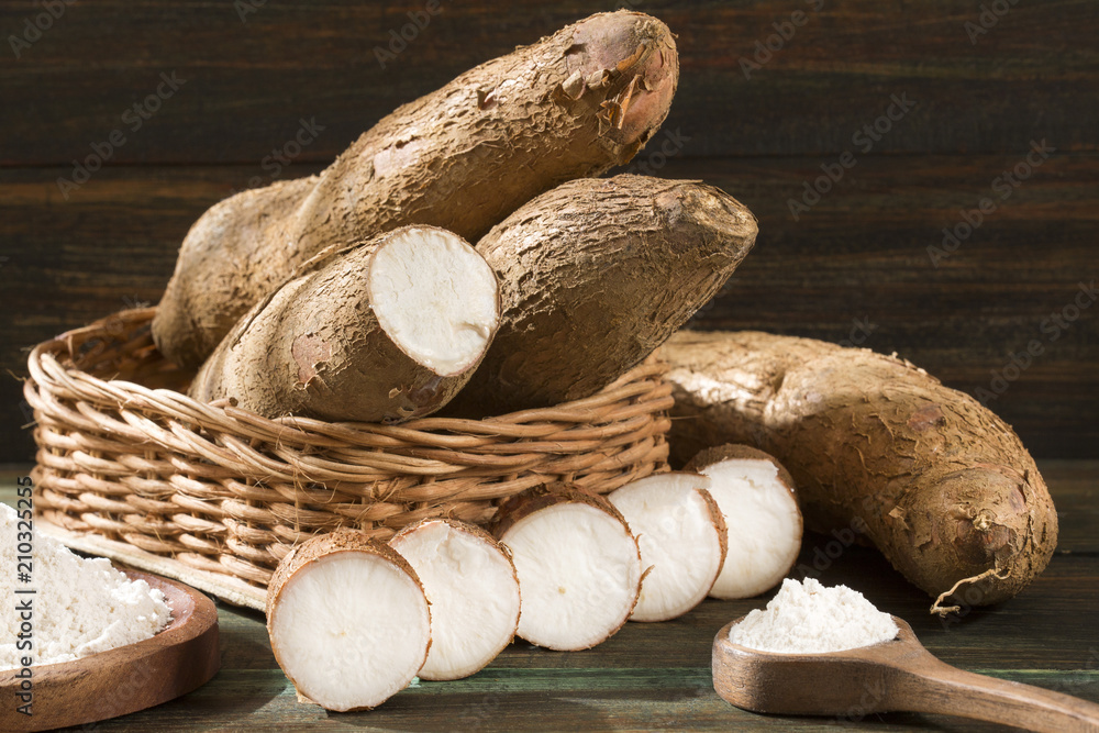 Raw cassava starch - Manihot esculenta. Wooden background Raw cassava starch - Manihot esculenta. Wooden background