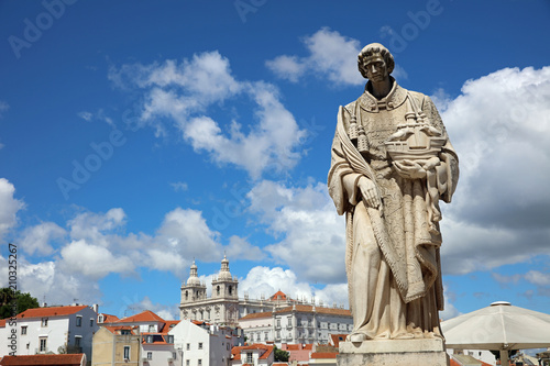 Sculpture of Sao Vicente (St. Vincent of Saragossa), Lisbon's Patron Saint, with Igreja de Sao Vicente de Fora in the Background. Lisbon. Portugal