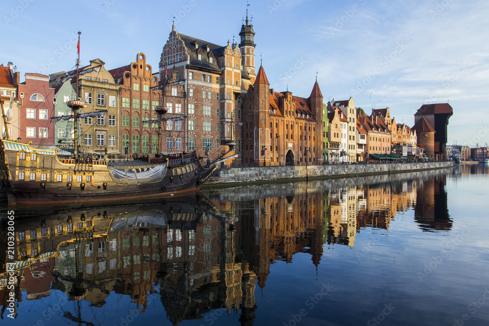 Ancient colored houses on the promenade of the river at dawn in Gdansk. Poland Ancient colored houses on the promenade of the river at dawn in Gdansk. Poland