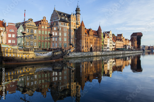 Ancient colored houses on the promenade of the river at dawn in Gdansk. Poland