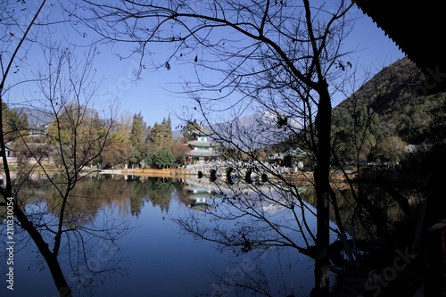 Wallpaper Mural Black Dragon Pool view through branches (Lijiang, Yunnan, China) Torontodigital.ca