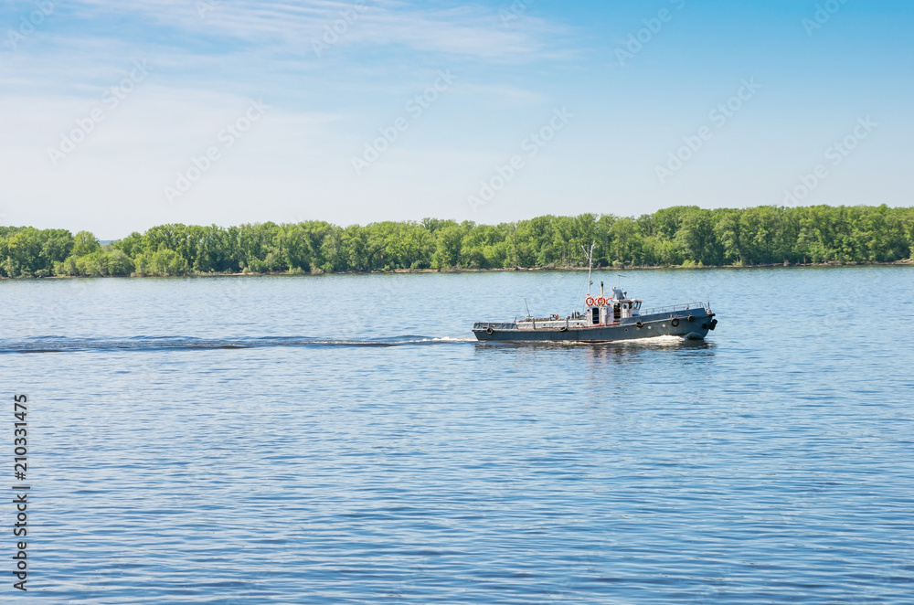 Tugboat on the Volga River, in Samara. The picture was taken in Russia, in the city of Samara. 05/22/2018 Tugboat on the Volga River, in Samara. The picture was taken in Russia, in the city of Samara. 05/22/2018