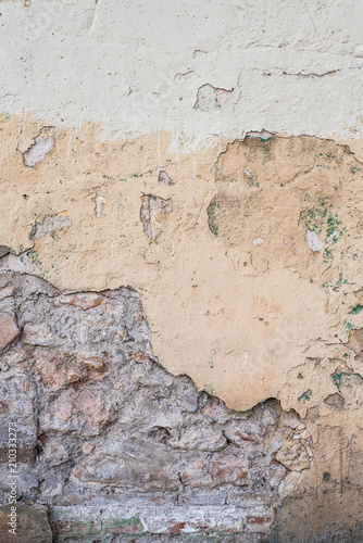 texture of battered, dirty and old brick wall and floor of various colors