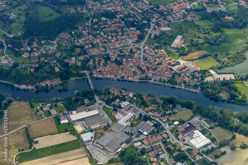 aerial of Brivio village on Adda river , Italy
