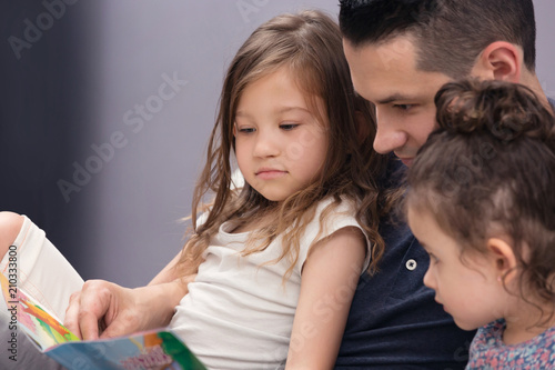 Father Reading His Daughters Stories