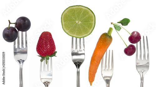 diet concept, fruit and vegetables on the forks, isolated on white background