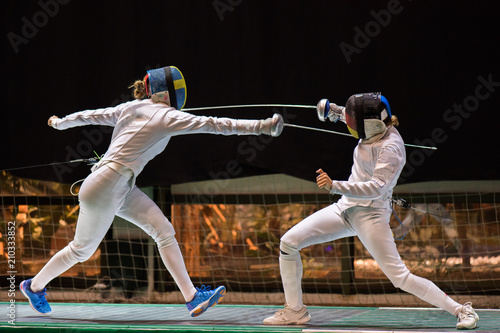 Fotografija Two woman fencing athletes fight