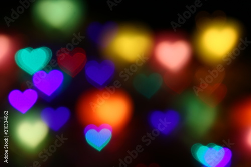 Valentines Colorful heart-shaped bokeh on black background lighting bokeh for decoration at night backdrop wallpaper blur valentine, Love Pictures background, Lighting heart shaped soft night abstract