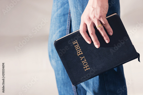 Fotografie Man Holding Bible to His Side