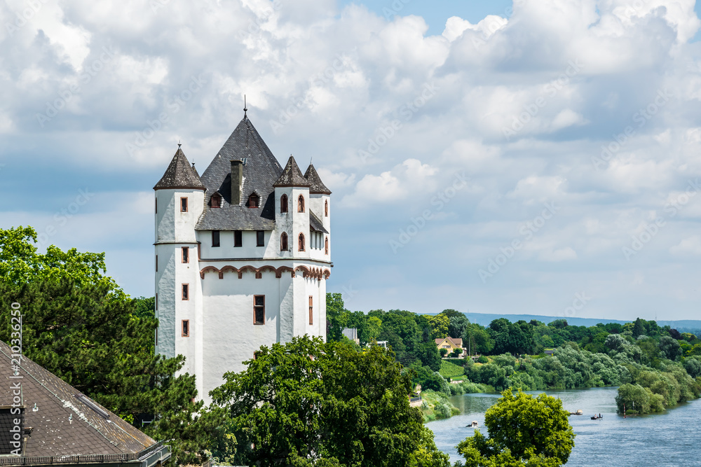 Fototapeta premium A view on the Tower of the Castle from a higher Ground over Eltville on the Rosentage at the River Rhein in Rheinland-Pfalz in Germany