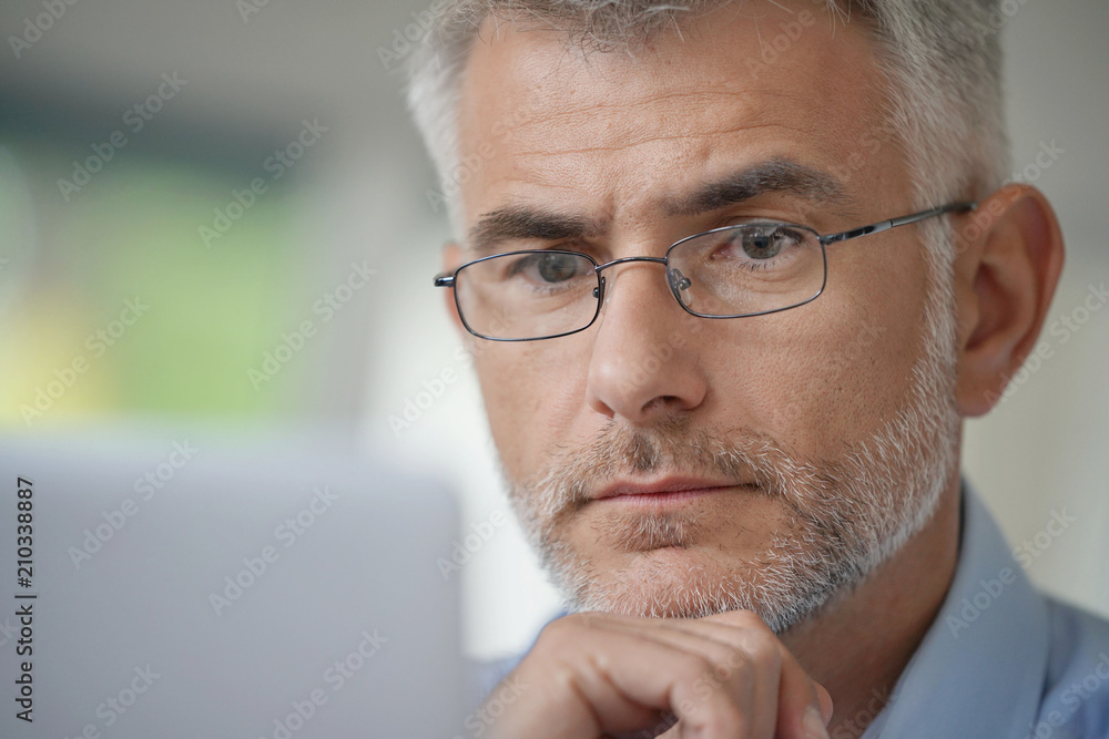 Portrait of middle-aged man with eyeglasses and grey hair Portrait of middle-aged man with eyeglasses and grey hair