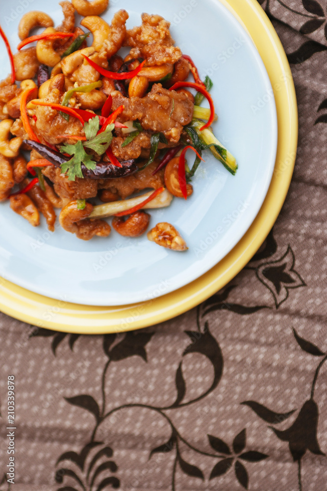 Stir fry chicken cashew nut with chili peppers and vegetable top view Stir fry chicken cashew nut with chili peppers and vegetable top view