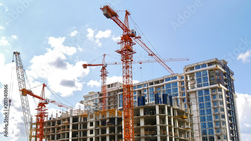 Construction cranes near building. Construction site.