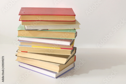 a stack of old books on a white background