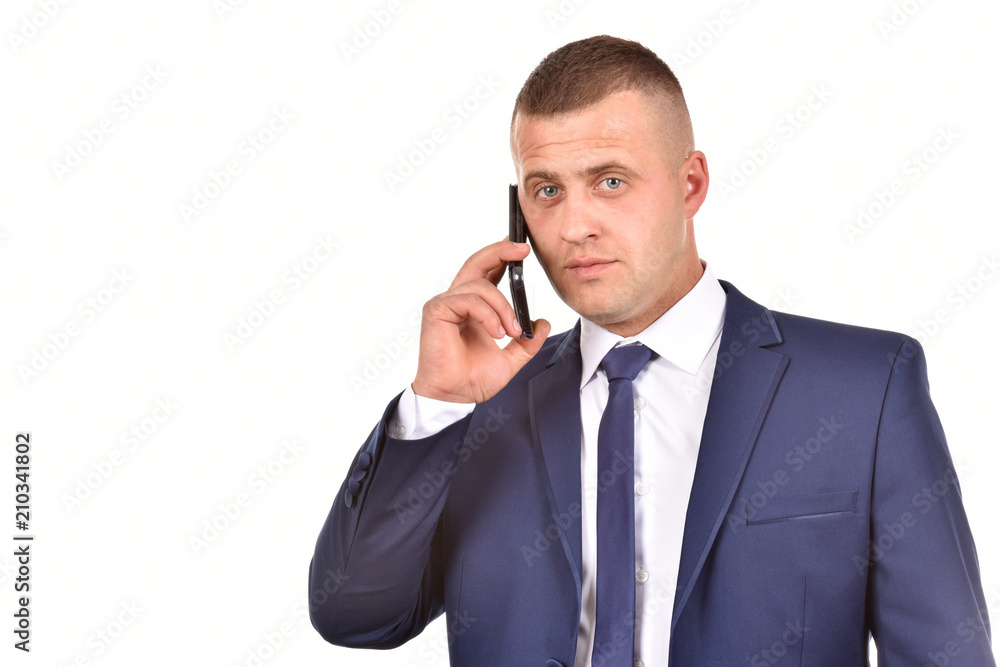 A man in a suit with a mobile phone. Confident businessman. Office worker on a white background. A man in a suit with a mobile phone. Confident businessman. Office worker on a white background.