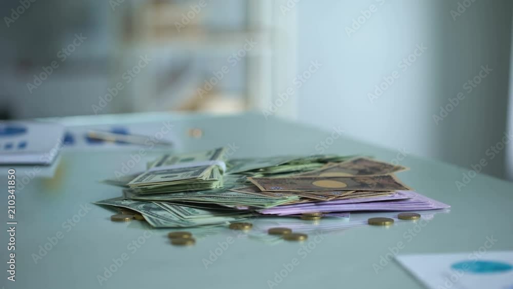 Man protecting money on table, safe bank deposit, financial operations control Man protecting money on table, safe bank deposit, financial operations control