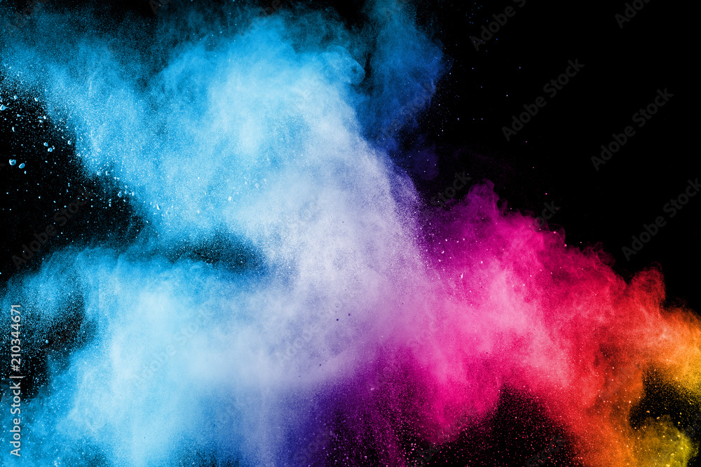 Color powder explosion.Colorful dust splash isolated on black background.