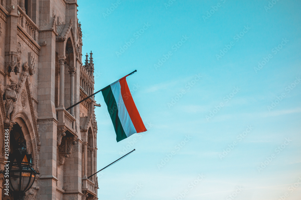 Hungary Flag at Parliament building with copy space in the sky