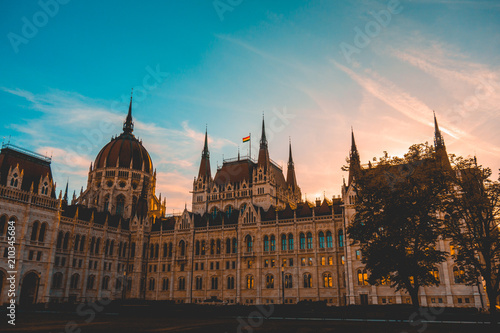 Parliament of Hungary in the afternoon with warm colored sky