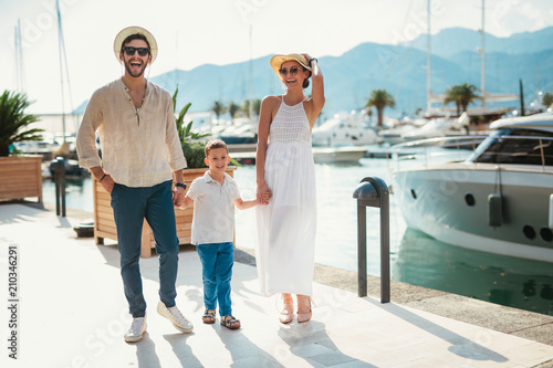 Happy family on holiday in front of boat having fun © Mediteraneo