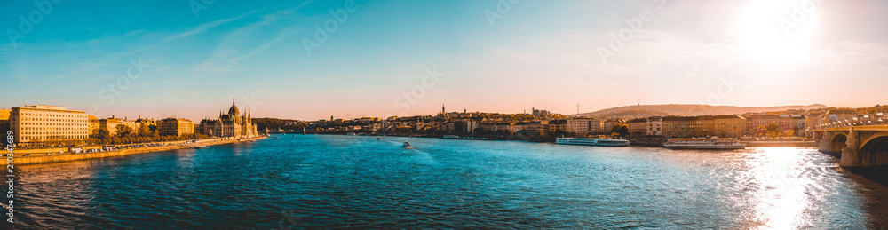 180 degree panorama about danube river at budapest with parliament on the left and ancient village side on the right