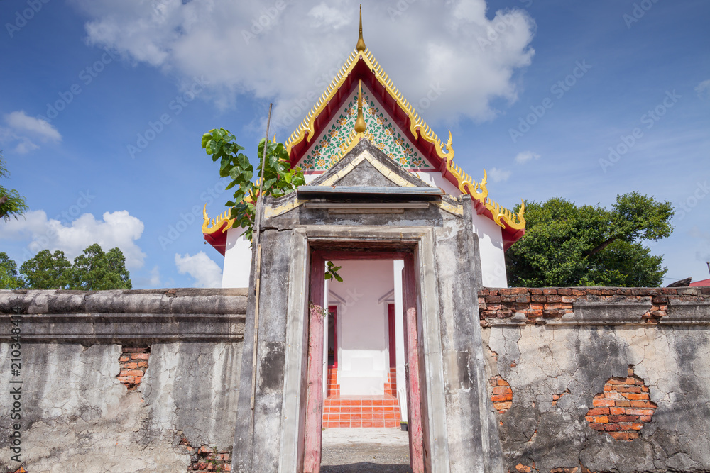 Fototapeta premium Thai stye temple in front of old wooden door.