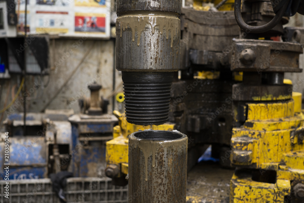 A view for drill pipe connection. View of drilling top drive system on board jack up drilling rig. A view for drill pipe connection. View of drilling top drive system on board jack up drilling rig.