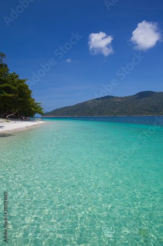 White sand beach with moutain under clear sky at ocean in Tropicana located at south of Thailand 