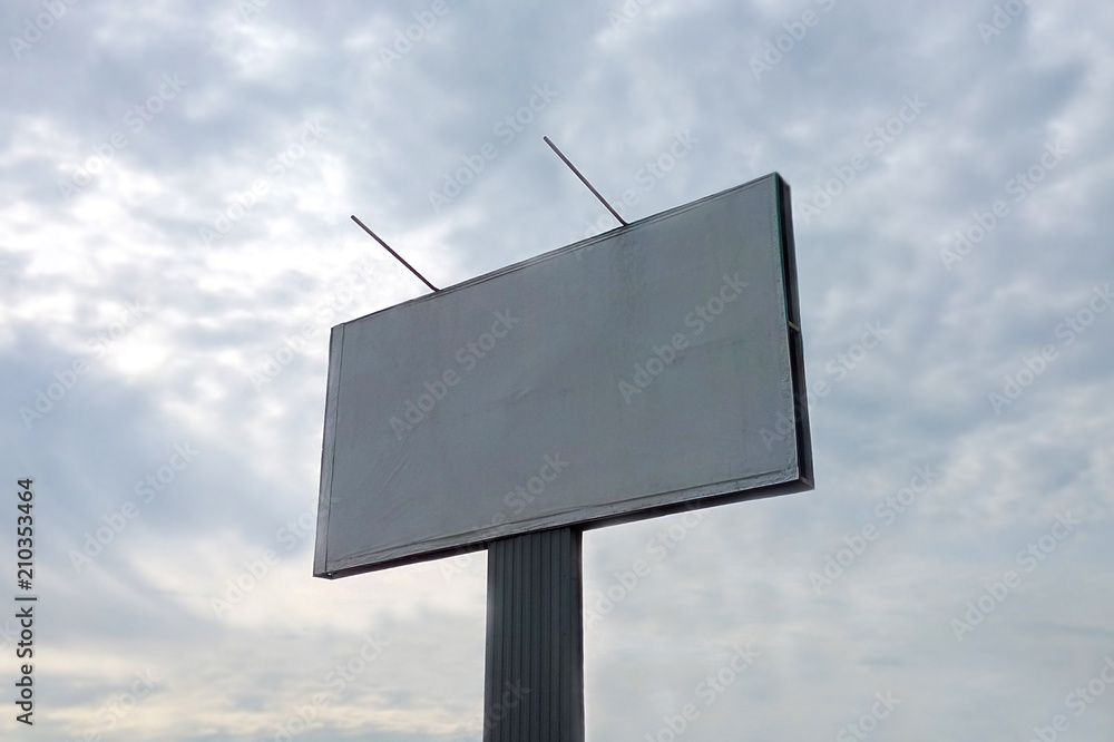 Billboard against the sky against the blue sky concept of outdoor advertising, marketing, layout Billboard against the sky against the blue sky concept of outdoor advertising, marketing, layout