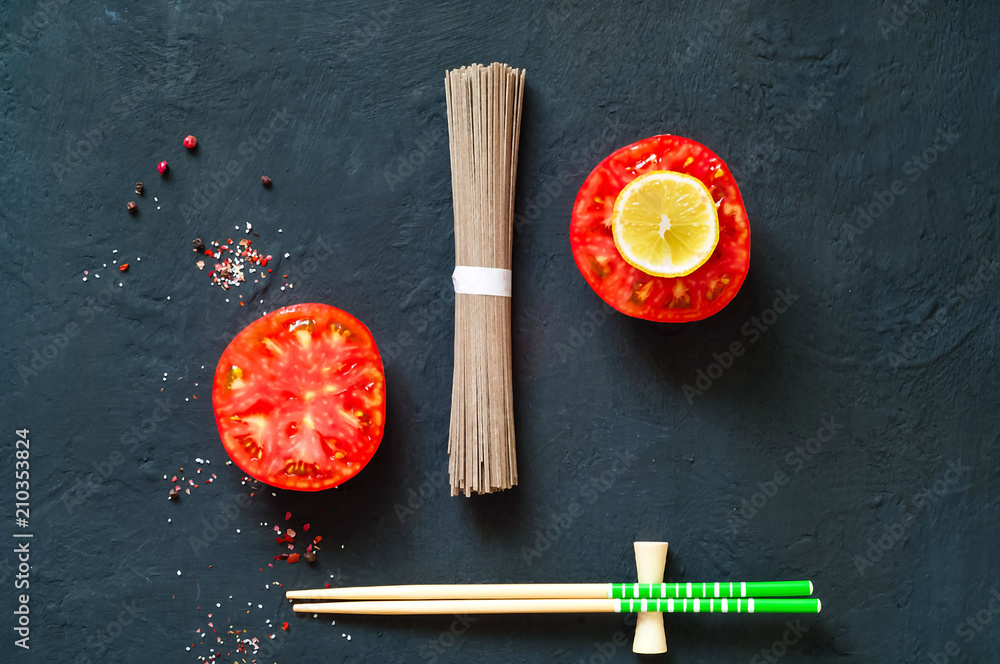 traditional japanese soba noodles and ingredients on dark background, concept of asian food and healthy diet, copy space, closeup traditional japanese soba noodles and ingredients on dark background, concept of asian food and healthy diet, copy space, closeup