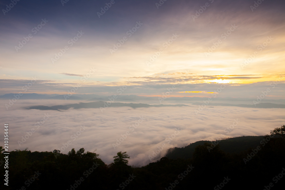 A cloudy of foggy landscape view on top view of mountain at sunrise timing in winter season located north of thailand 
