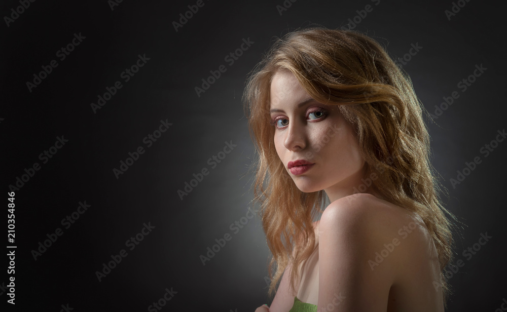Beautiful sexy blonde on a black background . Beautiful sexy blonde on a black background .