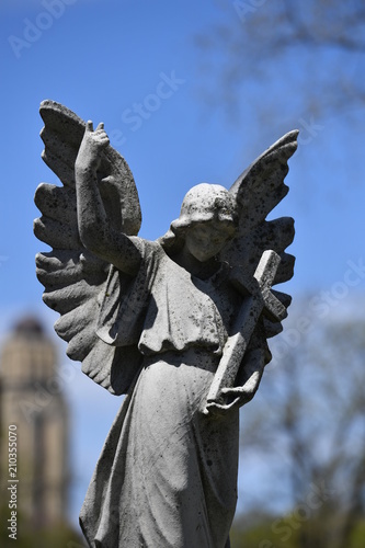 Sculpture of a warning angel on an old tomb of the cemetery of Montreal-Canada