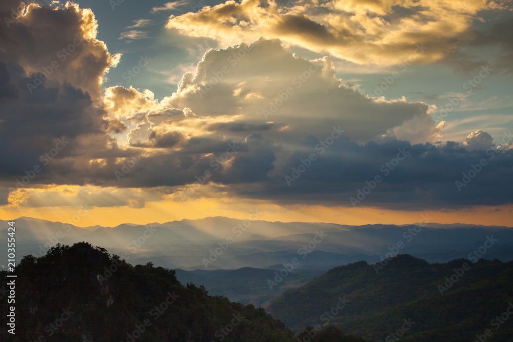 Colorful of sunset at mountain with cloudy on sky Colorful of sunset at mountain with cloudy on sky