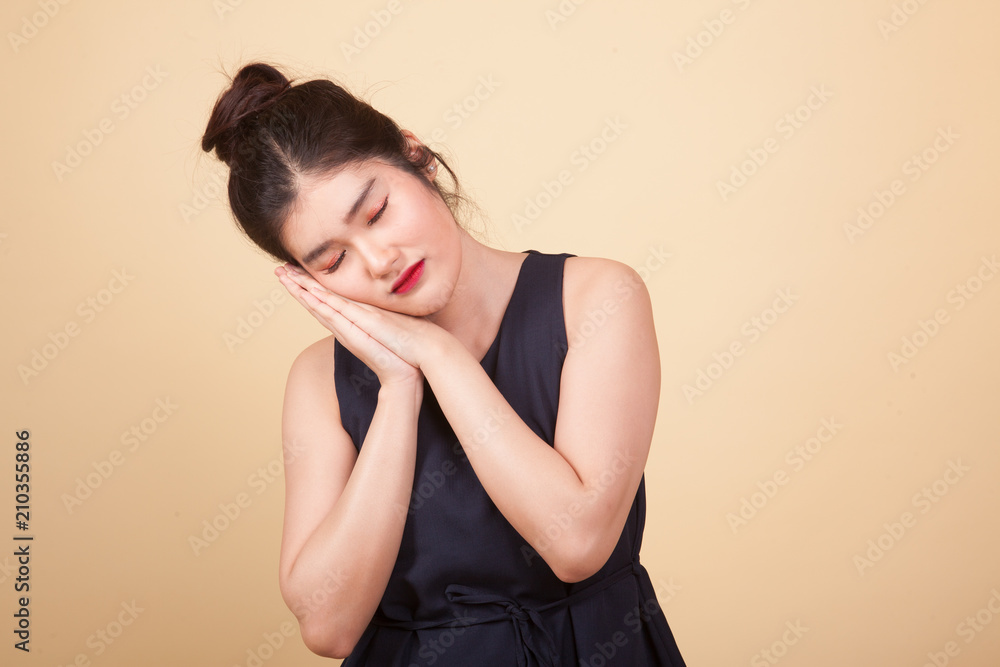 Beautiful young Asian woman with sleeping gesture. Beautiful young Asian woman with sleeping gesture.
