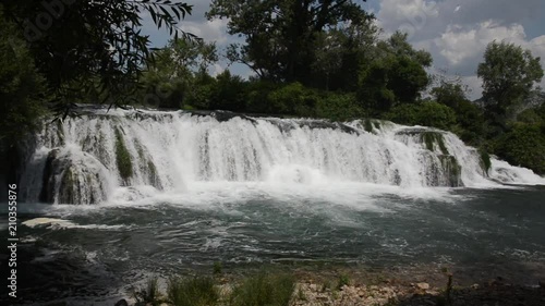 Crystal clear water and amazing waterfall in nature. Waterfall Kocusa, Ljubuski, southern Bosnia and Herzegovina. photo