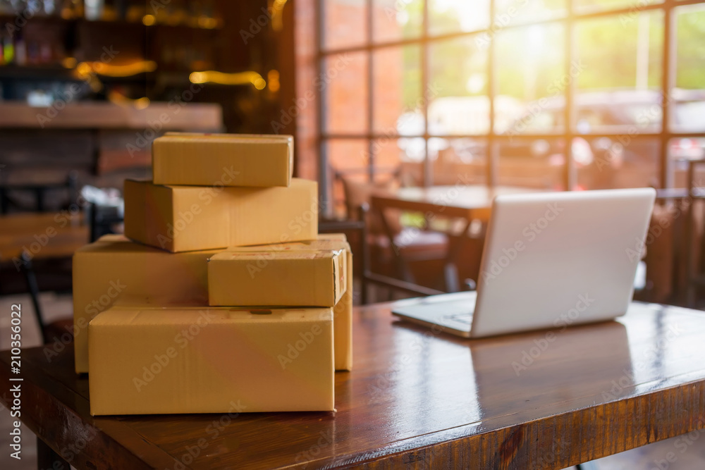 Packing accessories at workplace of startup small business owner, cardboard parcel box for online selling. entrepreneur,cardboard parcel box for online selling.shipping concept. Packing accessories at workplace of startup small business owner, cardboard parcel box for online selling. entrepreneur,cardboard parcel box for online selling.shipping concept.
