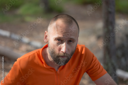 man in an orange shirt