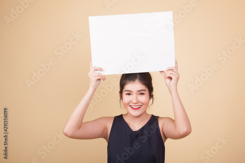 Young Asian woman with white blank sign.