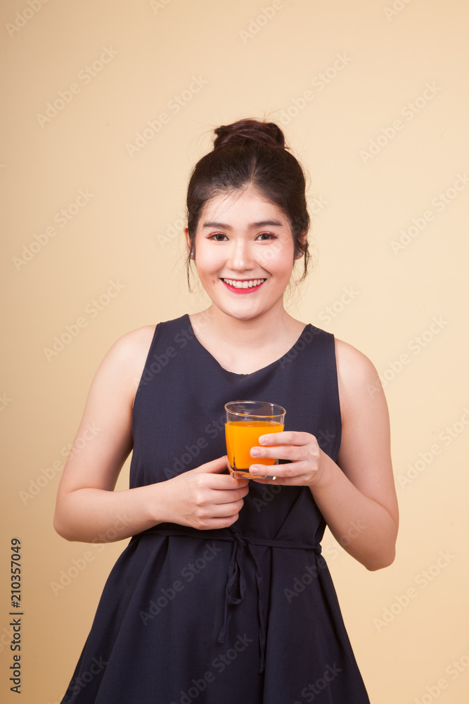 Young Asian woman drink orange juice. Young Asian woman drink orange juice.